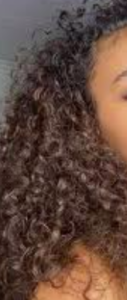 Dark brown long curly hair.